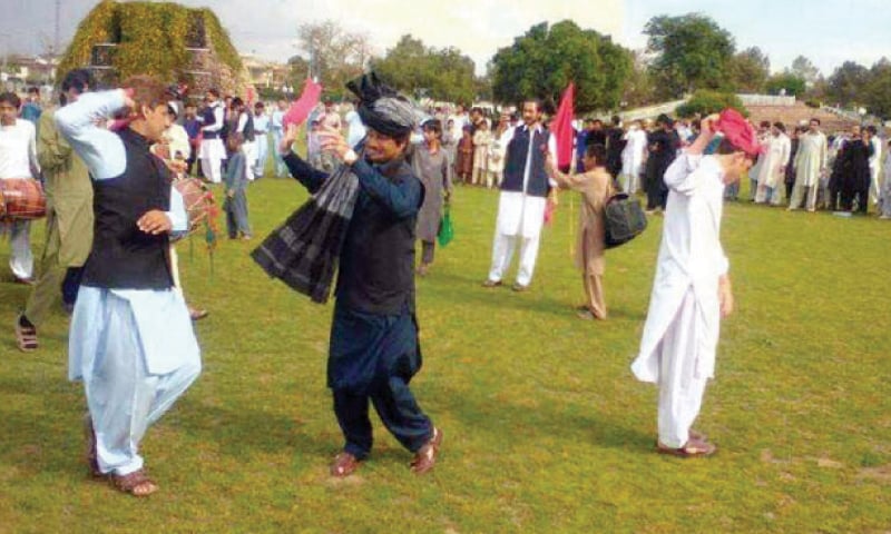 Youngsters perform Attanr dance at Bagh-i-Naran, Peshawar, on Friday. — Dawn Youngsters perform Attanr dance at Bagh-i-Naran, Peshawar, on Friday. — Dawn