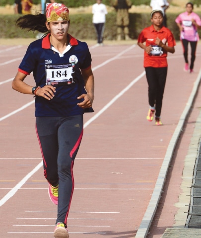 KARACHI: Rabia Ashiq competes on her way to winning the women&rsquo;s 5000m race during the 48th National Athletics Championships on Sunday.&mdash;Tahir Jamal/White Star