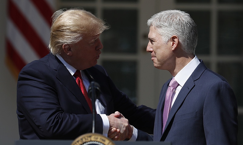 President Donald Trump shakes hands with Supreme Court Justice Neil Gorsuch in the Rose Garden of the White House White House in Washington, April 10, following a public swearing-in ceremony, for Gorsuch. ─ AP President Donald Trump shakes hands with Supreme Court Justice Neil Gorsuch in the Rose Garden of the White House White House in Washington, April 10, following a public swearing-in ceremony, for Gorsuch. ─ AP