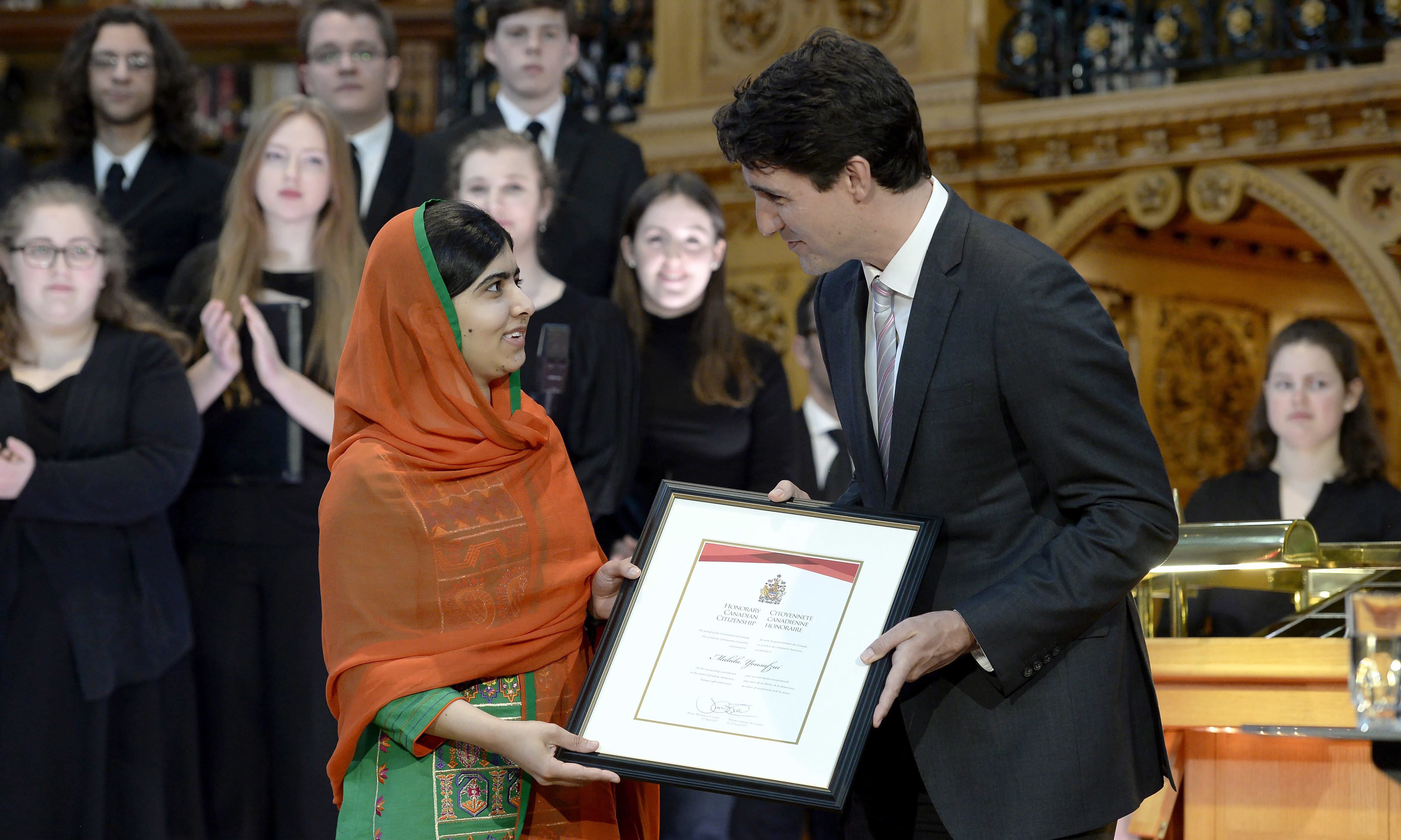 Malala Yousafzai is presented with an honorary Canadian citizenship by Prime Minister Justin Trudeau in on Parliament Hill in Ottawa. —AP