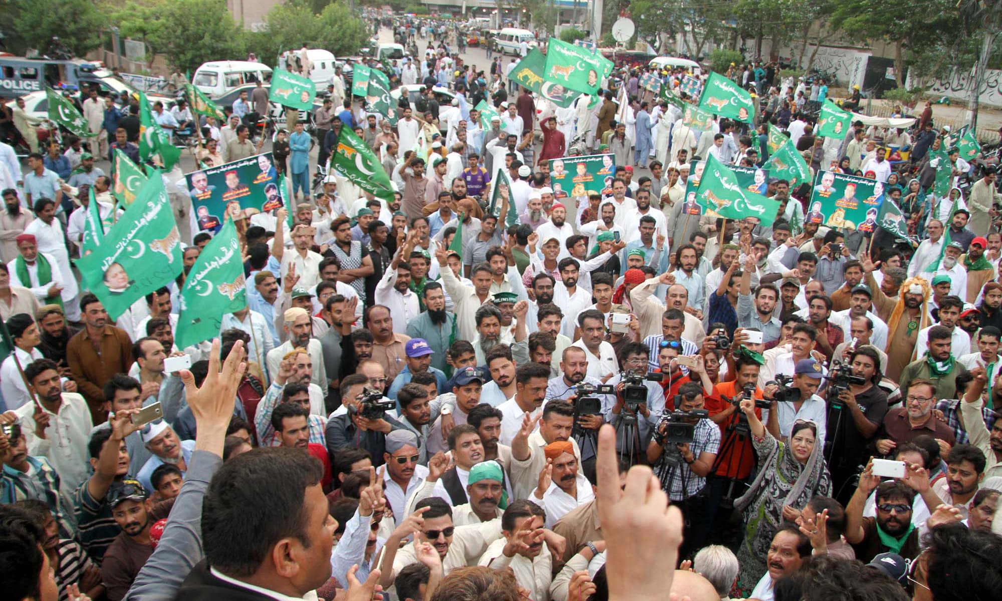 PML-N activists hold rally in favour of PM Nawaz Sharif in Karachi. —PPI