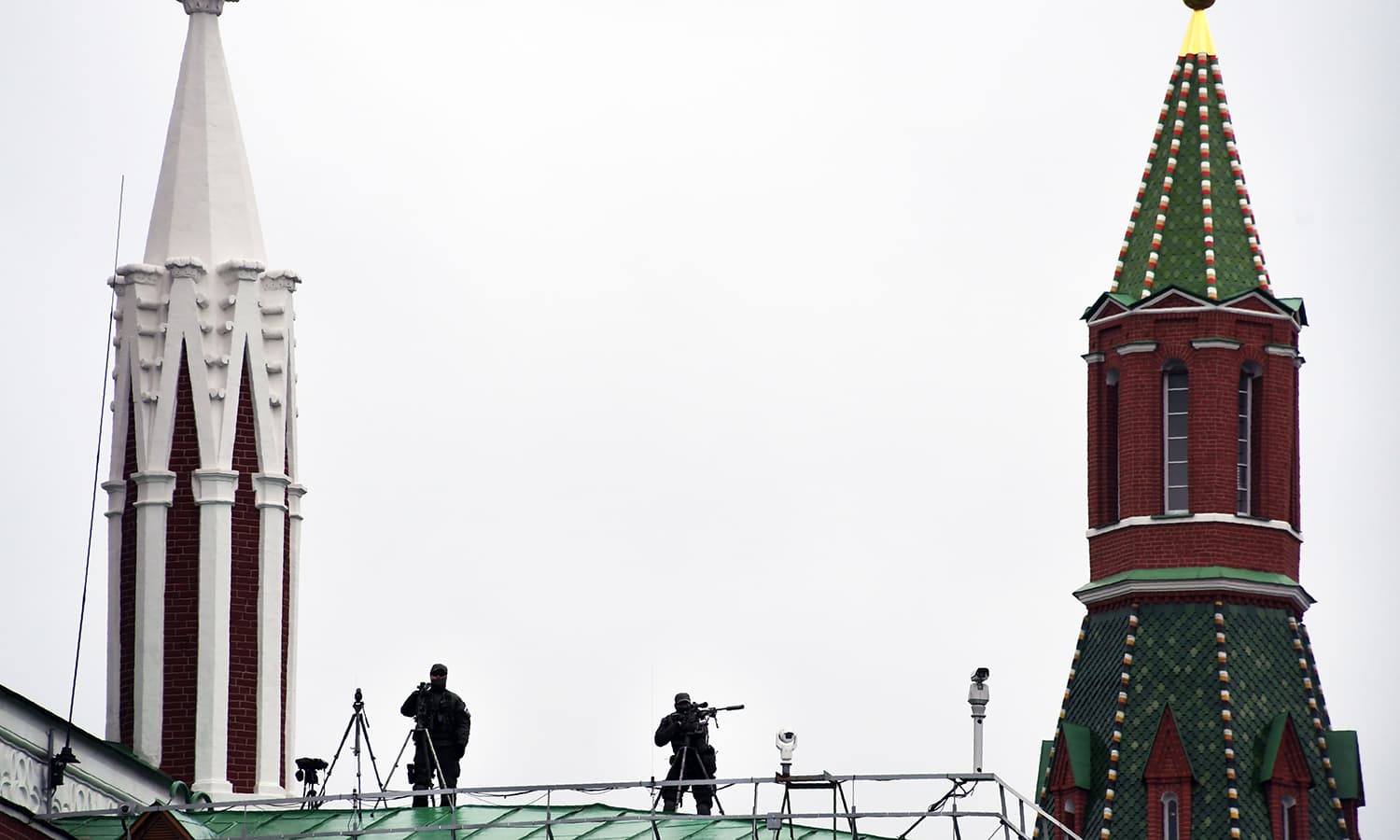 Snipers secure the area during the Victory Day military parade at Red Square in Moscow. -AFP