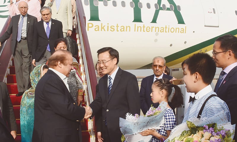 BEIJING: Accompanied by Finance Minister Ishaq Dar, Adviser to the PM Sartaj Aziz and the chief ministers of Punjab, Sindh, Balochistan and Khyber Pakhtunkhwa, Prime Minister Nawaz Sharif is being received by Li Shixiang, the vice chairman of the Beijing Municipal Chinese People&rsquo;s Political Consultative Conf&shy;e&shy;rence, and China&rsquo;s Ambassador to Pakistan Sun Weidong upon his arrival in the city for the two-day One-Belt-One-Road forum.&mdash;APP