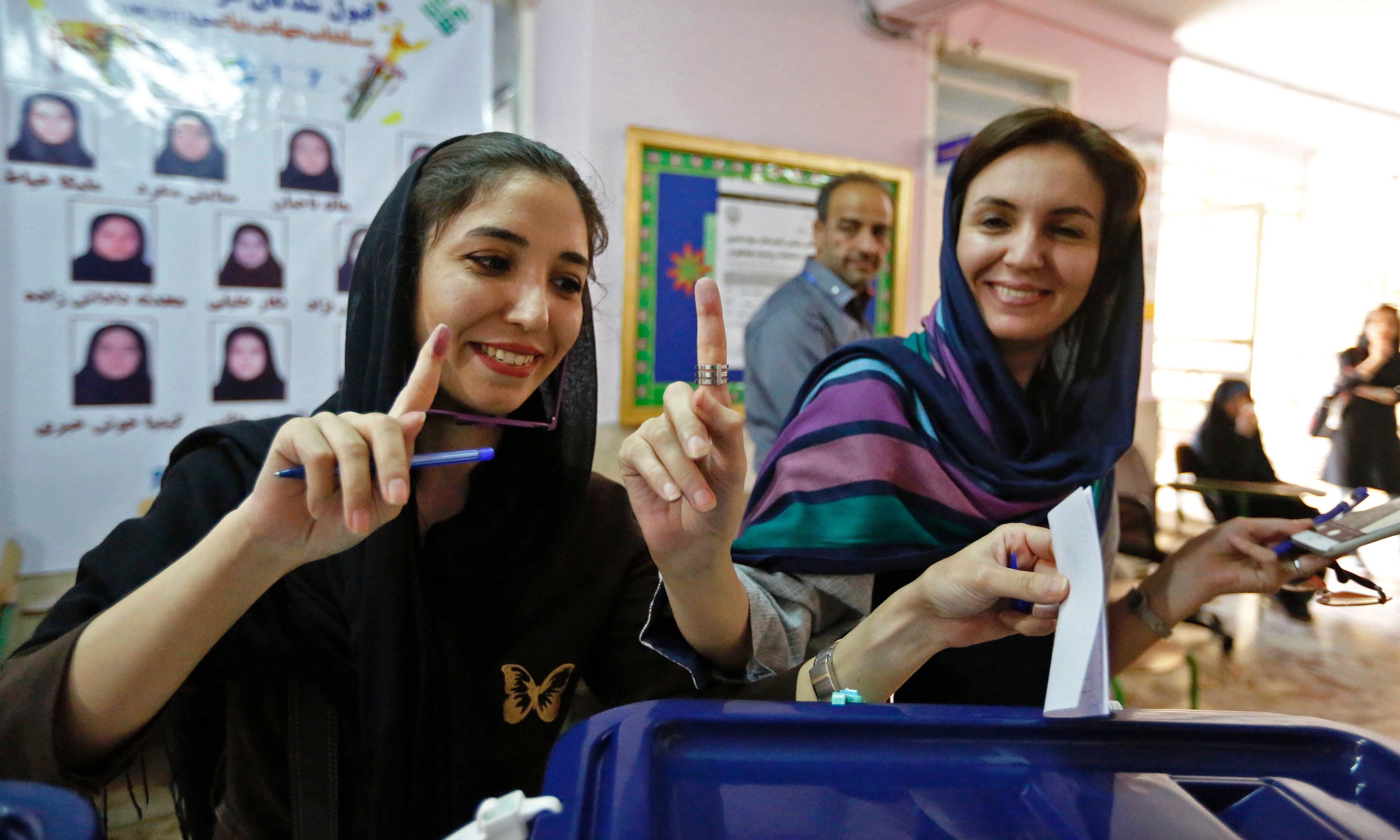 Women cast their ballots for the presidential elections at a polling station at the Lorzadeh mosque in Tehran. —AFP Women cast their ballots for the presidential elections at a polling station at the Lorzadeh mosque in Tehran. —AFP