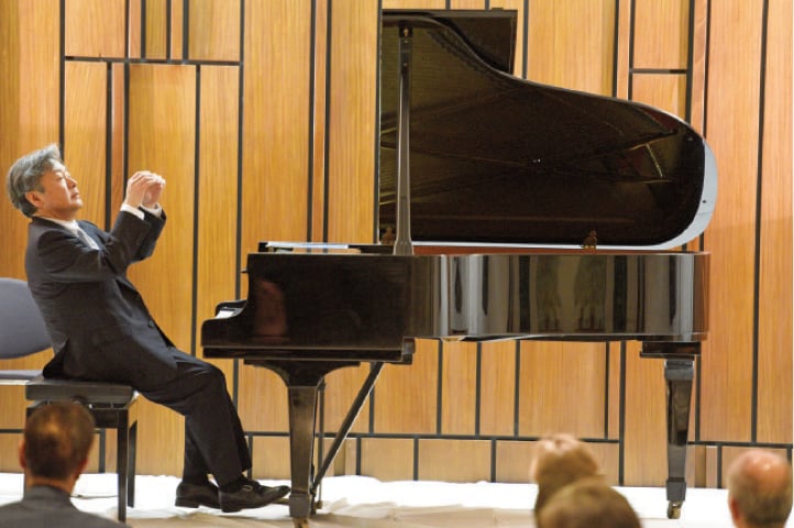 Maestro Jun Kanno plays the piano at the German embassy auditorium on Monday. — Photo by Tanveer Shahzad