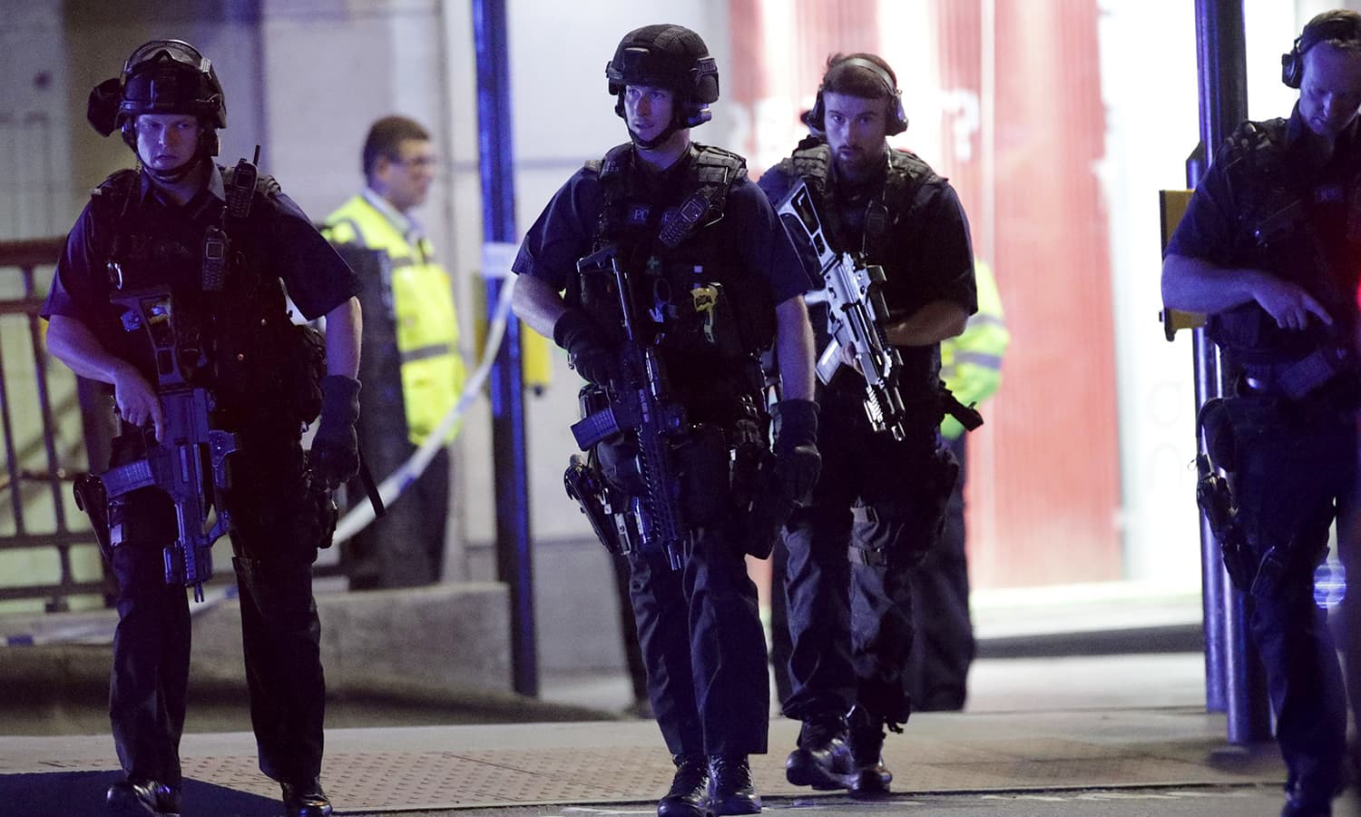 Armed police outside Monument Station after the attack. ─ AP