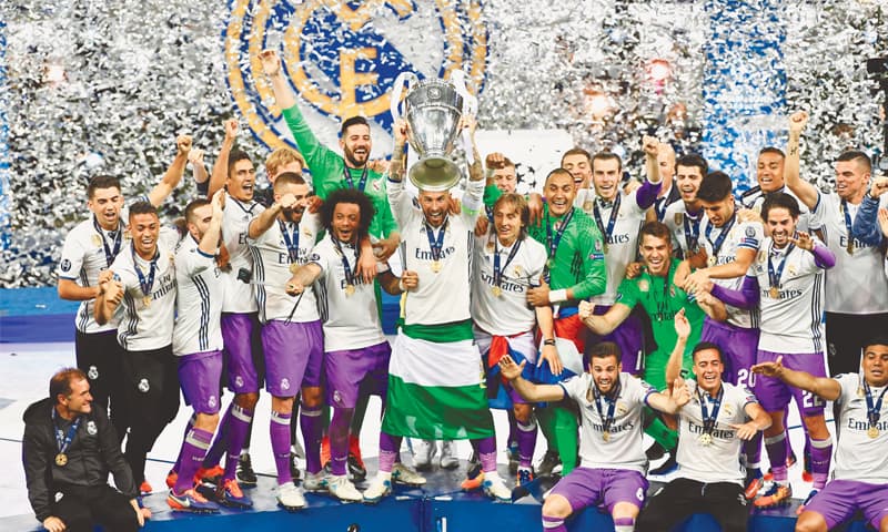 CARDIFF: Real Madrid&rsquo;s skipper Sergio Ramos lifts the UEFA Champions League trophy after defeating Juventus 4-1 in the final at The Principality Stadium.&mdash;AFP