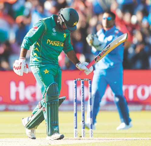 BIRMINGHAM: Pakistan captain Sarfraz Ahmed looks dejected after being dismissed by Indian pacer Hardik Pandya.&mdash;Reuters