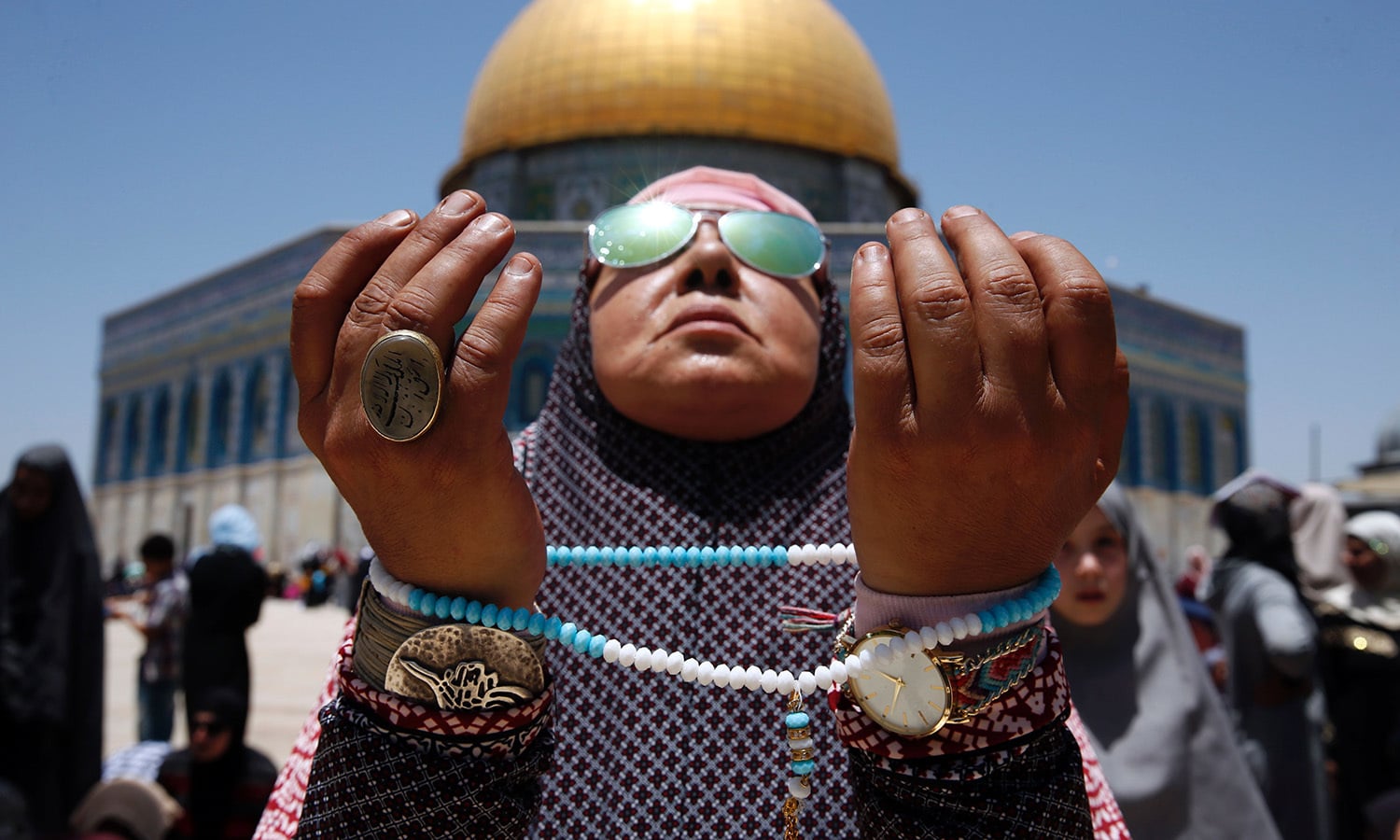 A Palestinian worshipper attends the second Friday prayers of Ramazan in front of the Dome of the Rock at Jerusalem's al-Aqsa mosque compound on June 9.— AFP