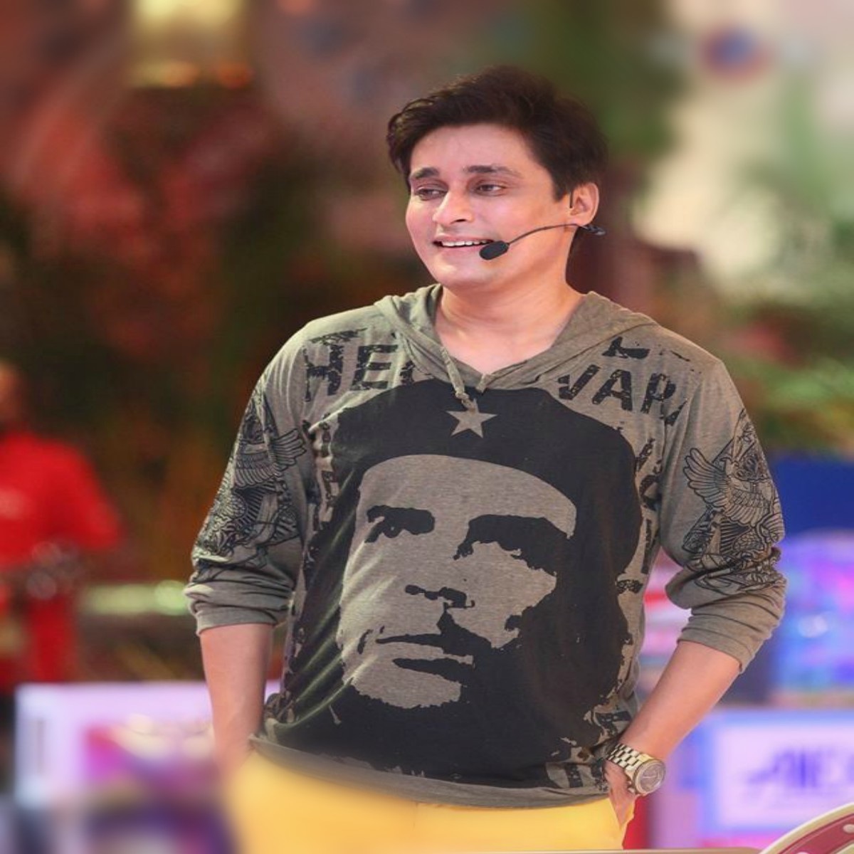 Sahir Lodhi in a a grey Che Guevara hoodie, paired with electric yellow pants.