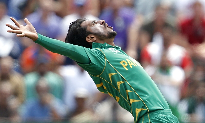 Hasan Ali celebrates after taking the wicket of England's Eoin Morgan during the Champions Trophy semi final.— Reuters