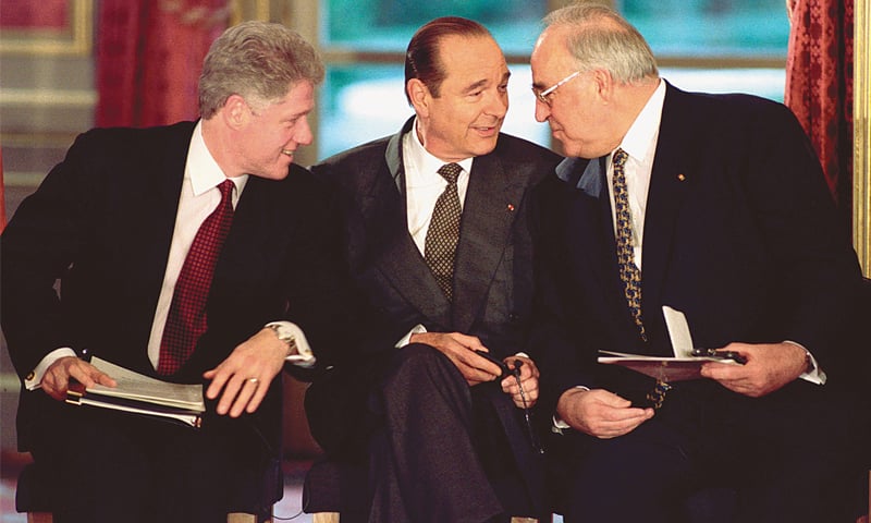 US president Bill Clinton, his French counterpart Jacques Chirac and German chancellor Helmut Kohl talk as they attend the signing of the Bosnian peace agreement in Paris on Dec 14, 1995.&mdash;Reuters
