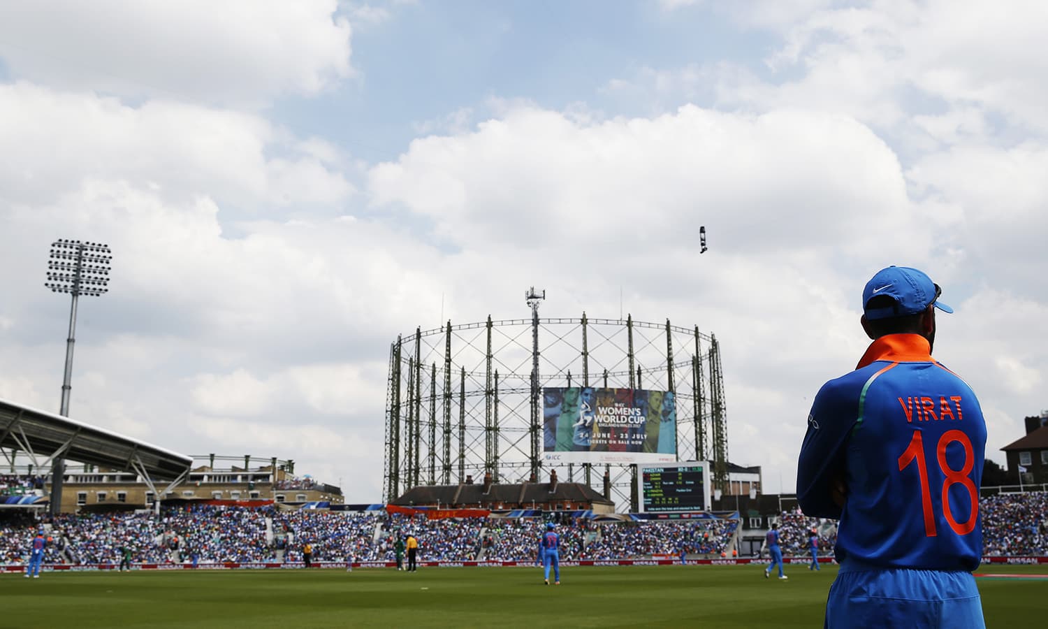 Virat Kohli watches the action from the boundary.─Reuters