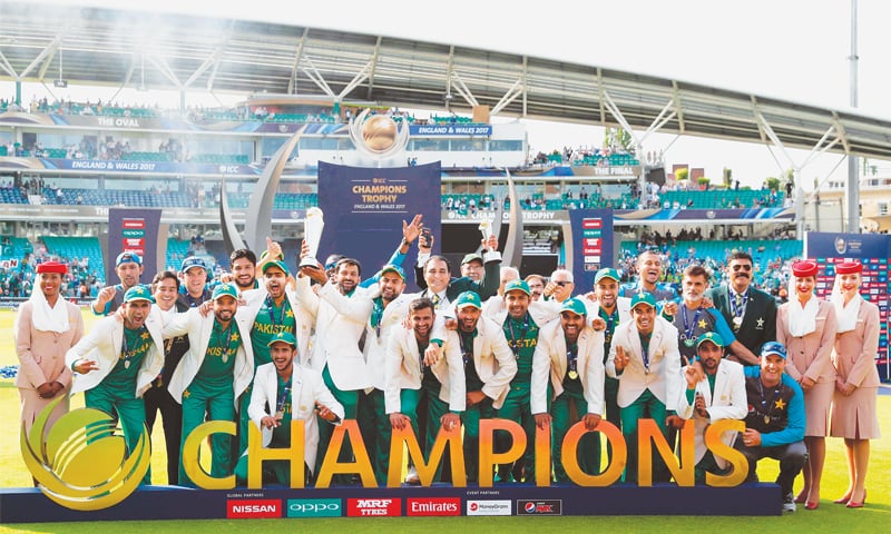 PAKISTANI players in a jubilant mood at the presentation ceremony while Mohammad Hafeez lifts the trophy.—AFP