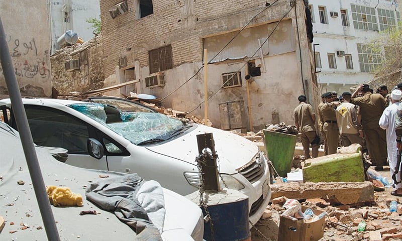 THIS picture released by a Saudi Arabian news agency shows security personnel inspecting a site where a bomber blew himself up.—Reuters