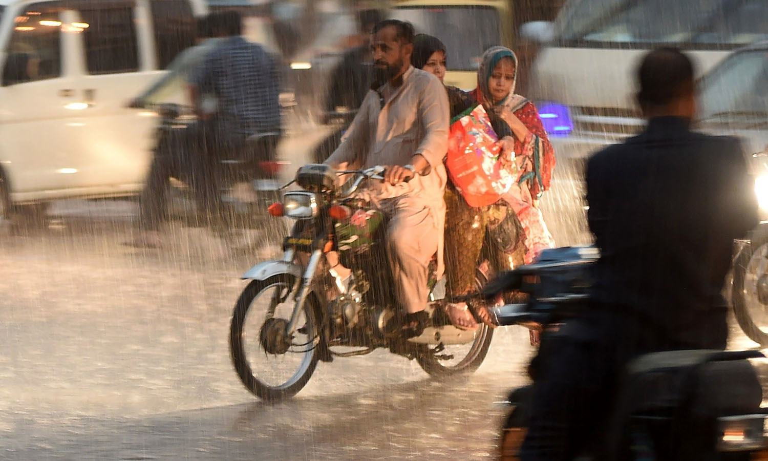 People found themselves stranded on the the roads as rain caused massive traffic issues all over the country. — AFP