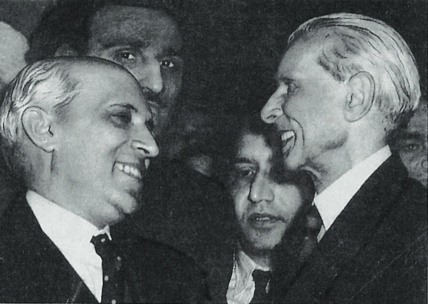 The Quaid-i-Azam, Mohammad Ali Jinnah and Jawaharlal Nehru caught smiling at each other at a reception at the India Office Library in London in December 1946. — Courtesy National Archives Islamabad