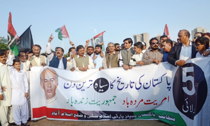 PPP leaders, including Nayyar Hussain Bukhari and Raja Imran Ashraf, stage a rally outside the National Press Club on Wednesday. &mdash; Photo by Ishaque Chaudhry