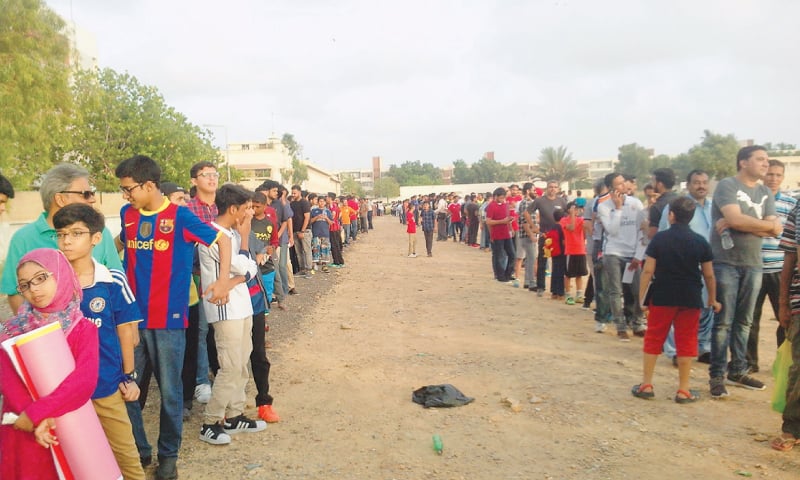 Long, unending queues of football enthusiasts didn't mind the waiting through extended security checks to watch Ronaldinho and friends play in Karachi on Saturday evening.— Photo by author