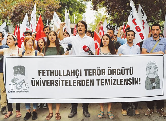 PRO-NATIONALIST university students hold a protest against US-based Fethullah Gulen and his followers during a demonstration in Ankara after last year’s abortive coup.—Reuters
