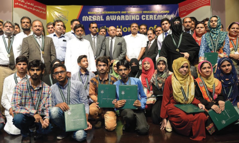 Matric position holders with Excise and Taxation Minister Mujtaba Shujaur Rehman. &mdash; White Star
