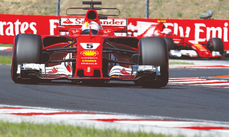 BUDAPEST: Ferrari&rsquo;s Sebastian Vettel steers his car during the Hungarian F1 Grand Prix on Sunday.&mdash;Reuters