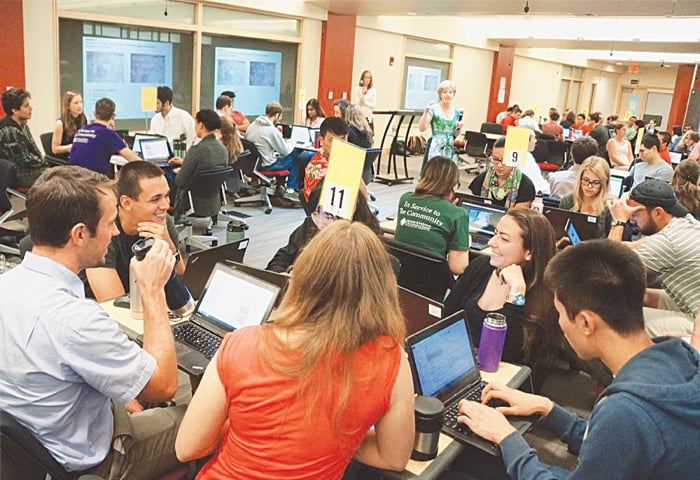 Kelly Butnor (centre), professor of pathology and laboratory medicine at the University of Vermont&rsquo;s Larner College of Medicine, conducts a team-based learning session with second-year students.