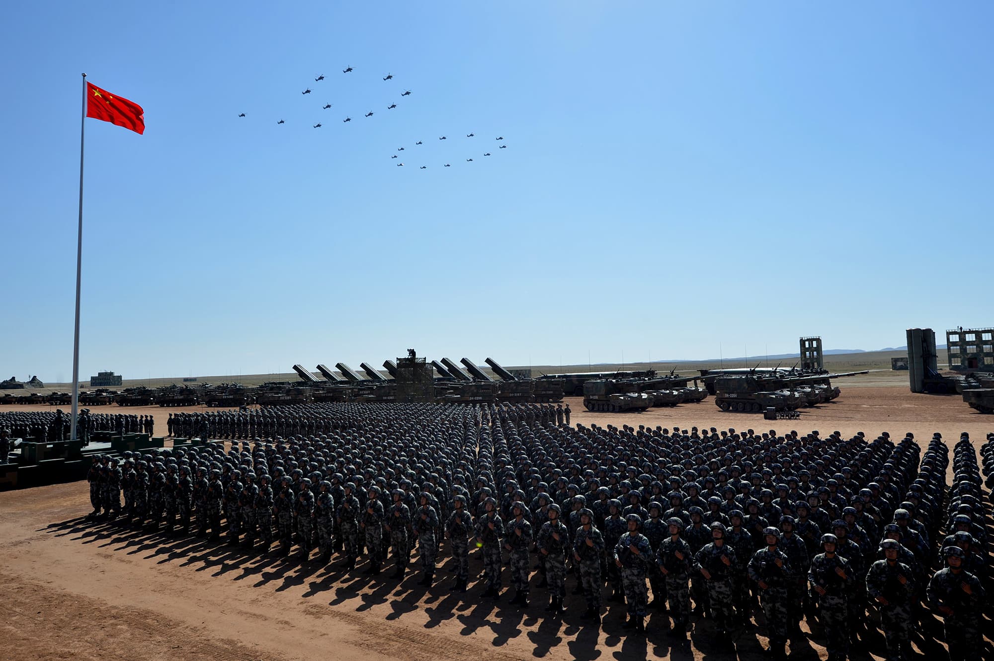 Chinese military helicopters fly in a formation to make the number "90" during a military parade at the Zhurihe training base in China's northern Inner Mongolia region on July 30, 2017. ─ AFP