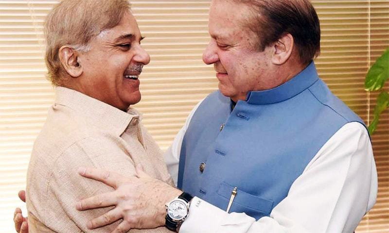 Former prime minister Nawaz Sharif (right) and Punjab Chief Minister Shahbaz Sharif (left) embrace after the Supreme Court announced its verdict in the Panama Papers case on April 20. 
 — File