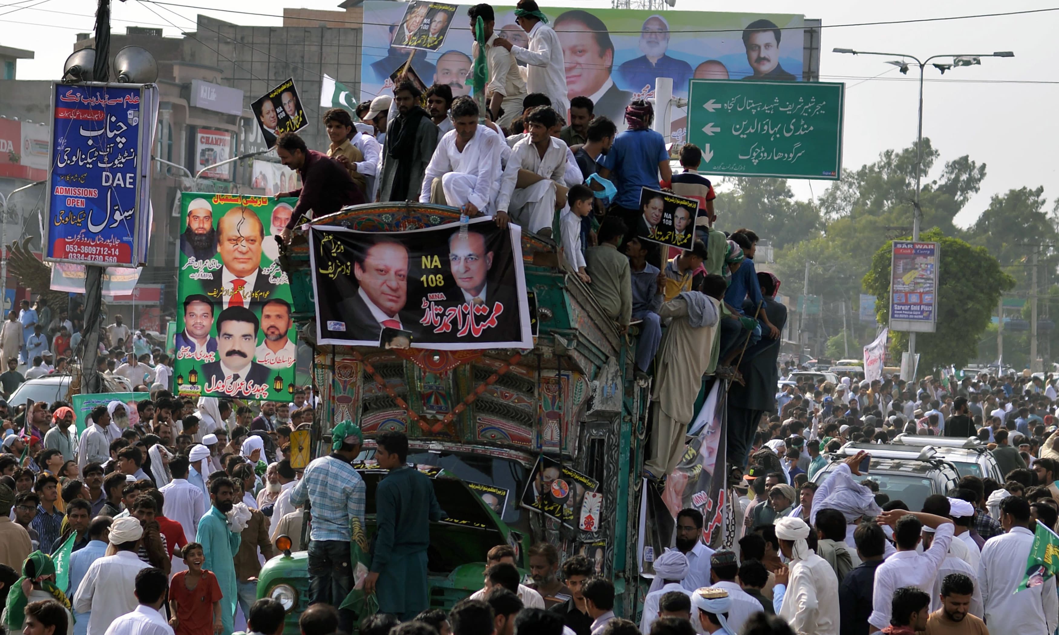 Supporters of Nawaz Sharif attend a rally in Gujrat. —AFP