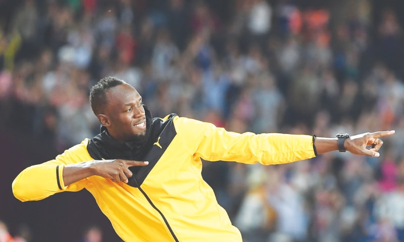 JAMAICA’S Usain Bolt strikes his trademark pose as he takes part in a lap of honour at the London Stadium.—AFP