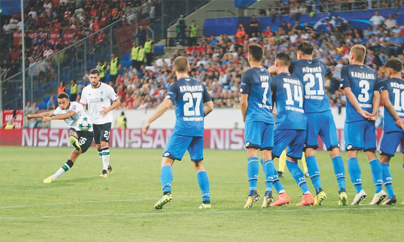 SINSHEIM (Germany): Liverpool’s Trent Alexander-Arnold (L) shoots to score on a free-kick during their Champions Leagues playoff first leg against 1899 Hoffenheim at the Rhein-Neckar-Arena.—AP