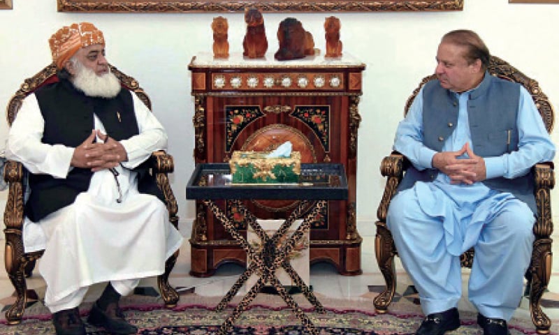 JUI-F chief Maulana Fazlur Rehman calls on former prime minister Nawaz Sharif. — Online