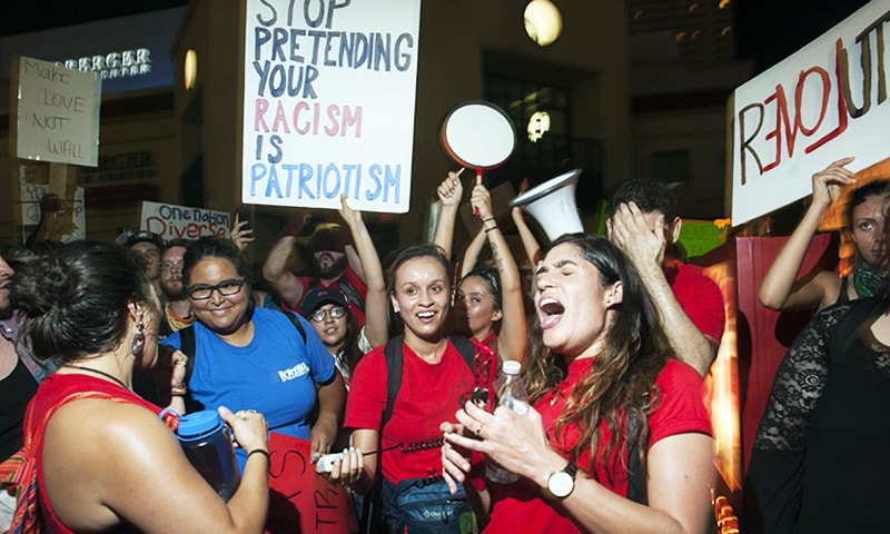 Protesters gather outside of  Phoenix, Arizona, Convention Center where US President Donald Trump spoke at a "Make America Great Again" rally.—AFP