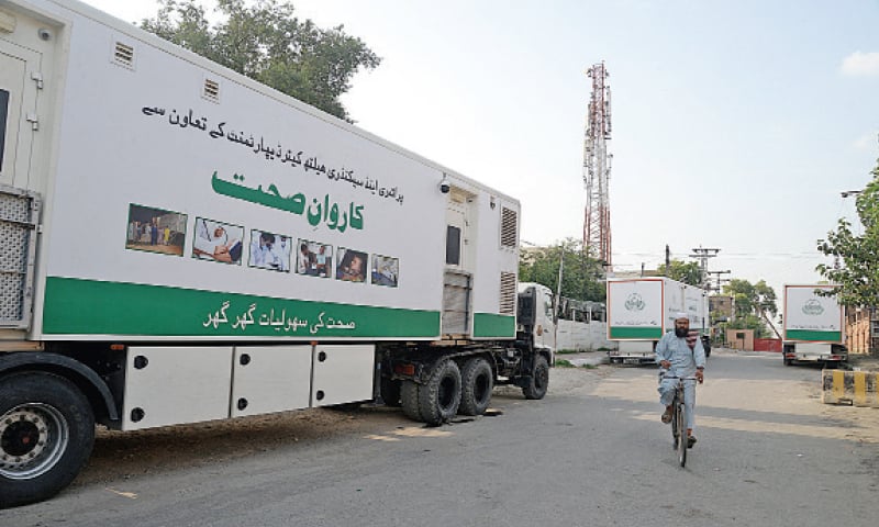 The mobile health units of Punjab government have been parked on Sher Shah Suri road near Peshawar Press Club. — White Star The mobile health units of Punjab government have been parked on Sher Shah Suri road near Peshawar Press Club. — White Star