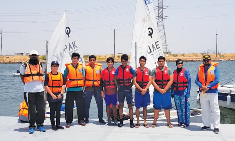 KARACHI: Some of the youth sailors who have been picked to attend training camp pose with their coaches at the PAF Korangi Creek.