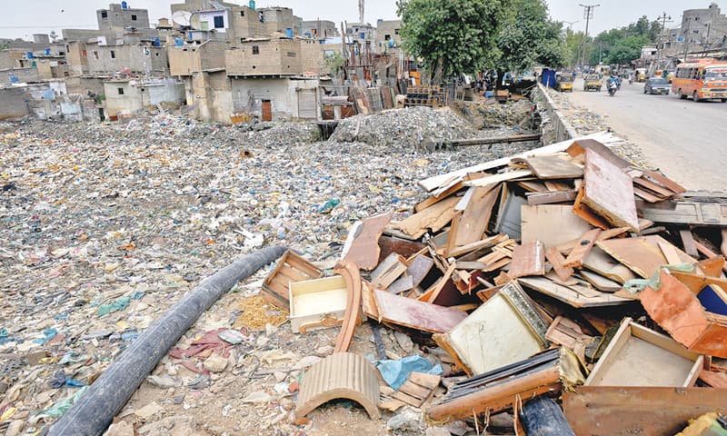 WHILE the authorities claimed to be prepared for the expected heavy rainfall, the state of this nullah in Nazimabad on Wednesday, filled with all sorts of debris, does not inspire confidence.—Fahim Siddiqi / White Star WHILE the authorities claimed to be prepared for the expected heavy rainfall, the state of this nullah in Nazimabad on Wednesday, filled with all sorts of debris, does not inspire confidence.—Fahim Siddiqi / White Star