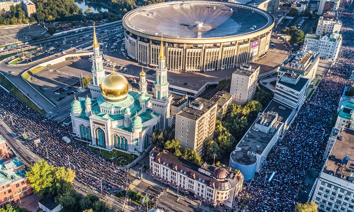 An aerial view taken with a drone shows members of Russia's Muslim community praying in a street outside the Central Mosque during Eidul Azha.—AFP