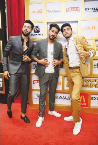 Fahad Mustafa, the leading actor in Na Maloom Afraad 2, with film director Nabeel Qureshi and one of the principal actors Mohsin Abbas Haider at the film premiere on Thursday evening.