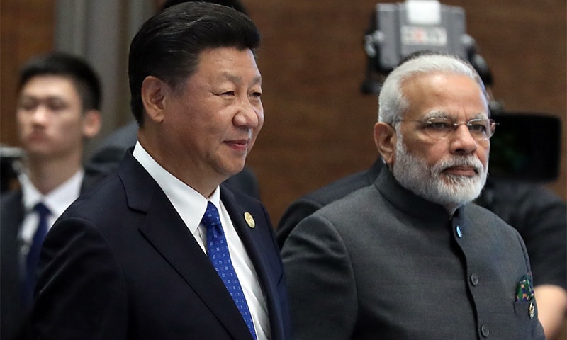 (L to R) Chinese President Xi Jinping and Indian Prime Minister Narendra Modi attend the Dialogue of Emerging Market and Developing Countries on the sidelines of the 2017 BRICS Summit in Xiamen, China's Fujian Province.—AFP