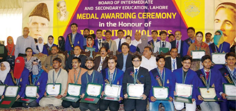 Position holders in intermediate exams with Punjab Higher Education Minister Raza Ali Gilani.