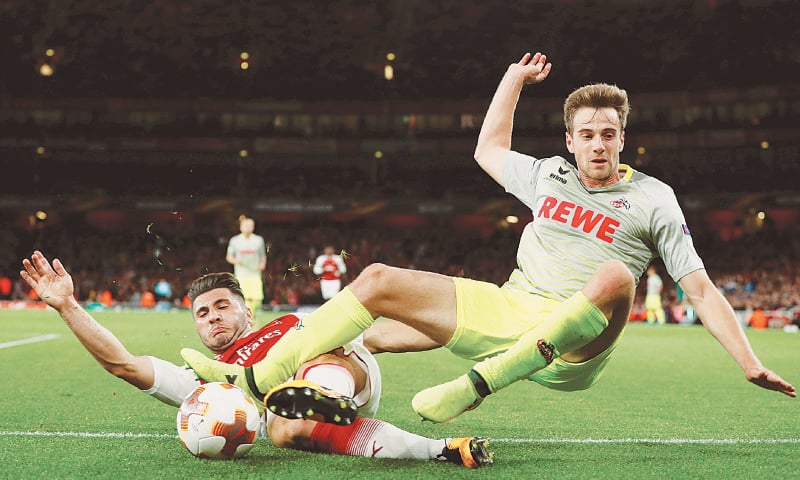 LONDON: Arsenal’s Sead Kolasinac (L) vies for the ball with FC Cologne’s Lukas Klunter during their Europa League match at the Emirates Stadium.—Reuters LONDON: Arsenal’s Sead Kolasinac (L) vies for the ball with FC Cologne’s Lukas Klunter during their Europa League match at the Emirates Stadium.—Reuters