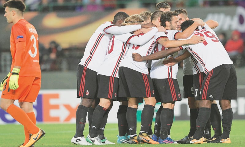 VIENNA: AC Milan players celebrate after taking a 4-1 lead against Austria Vienna.—AFP