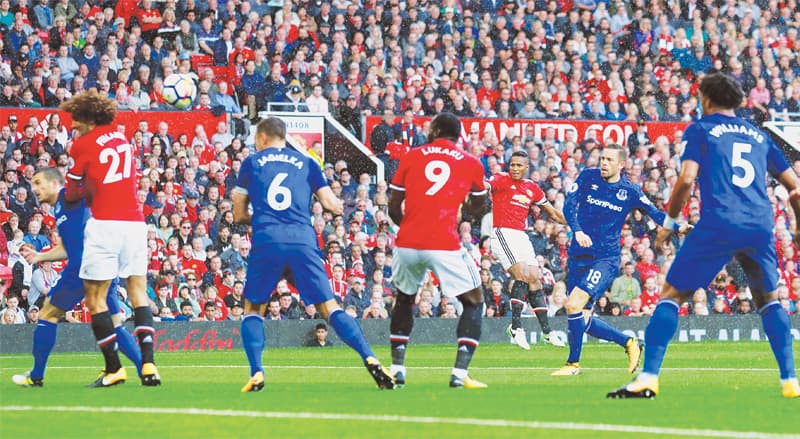 MANCHESTER: Manchester United’s Antonio Valencia (third R) scores during the Premier League match against Everton at Old Trafford on Sunday.—Reuters MANCHESTER: Manchester United’s Antonio Valencia (third R) scores during the Premier League match against Everton at Old Trafford on Sunday.—Reuters