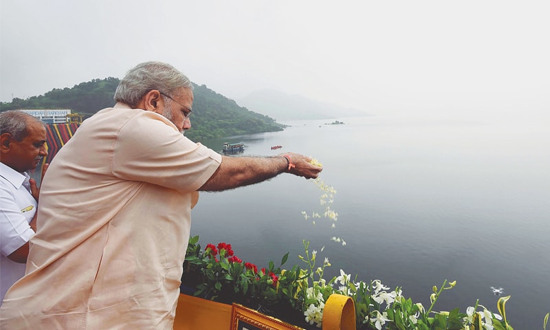 Indian Prime Minister Narendra Modi makes an offering at the site of Sardar Sarovar Dam on Sunday.&mdash;AFP