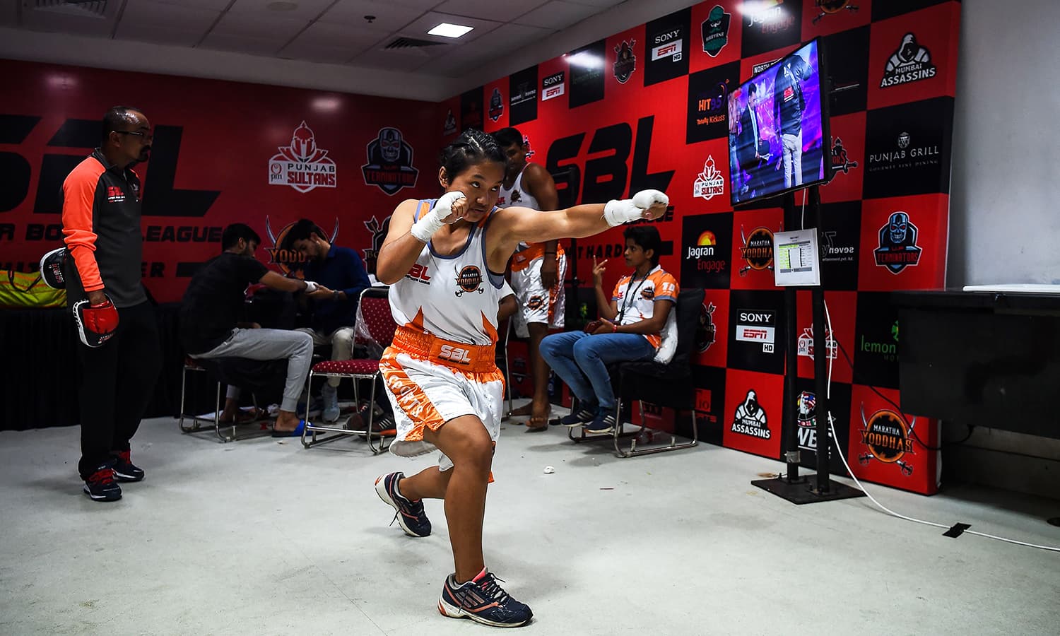 Boxer Lalnunfeli with the Maratha Yoddhas team prepares before her fight during a Super Boxing League event in New Delhi.&mdash; AFP