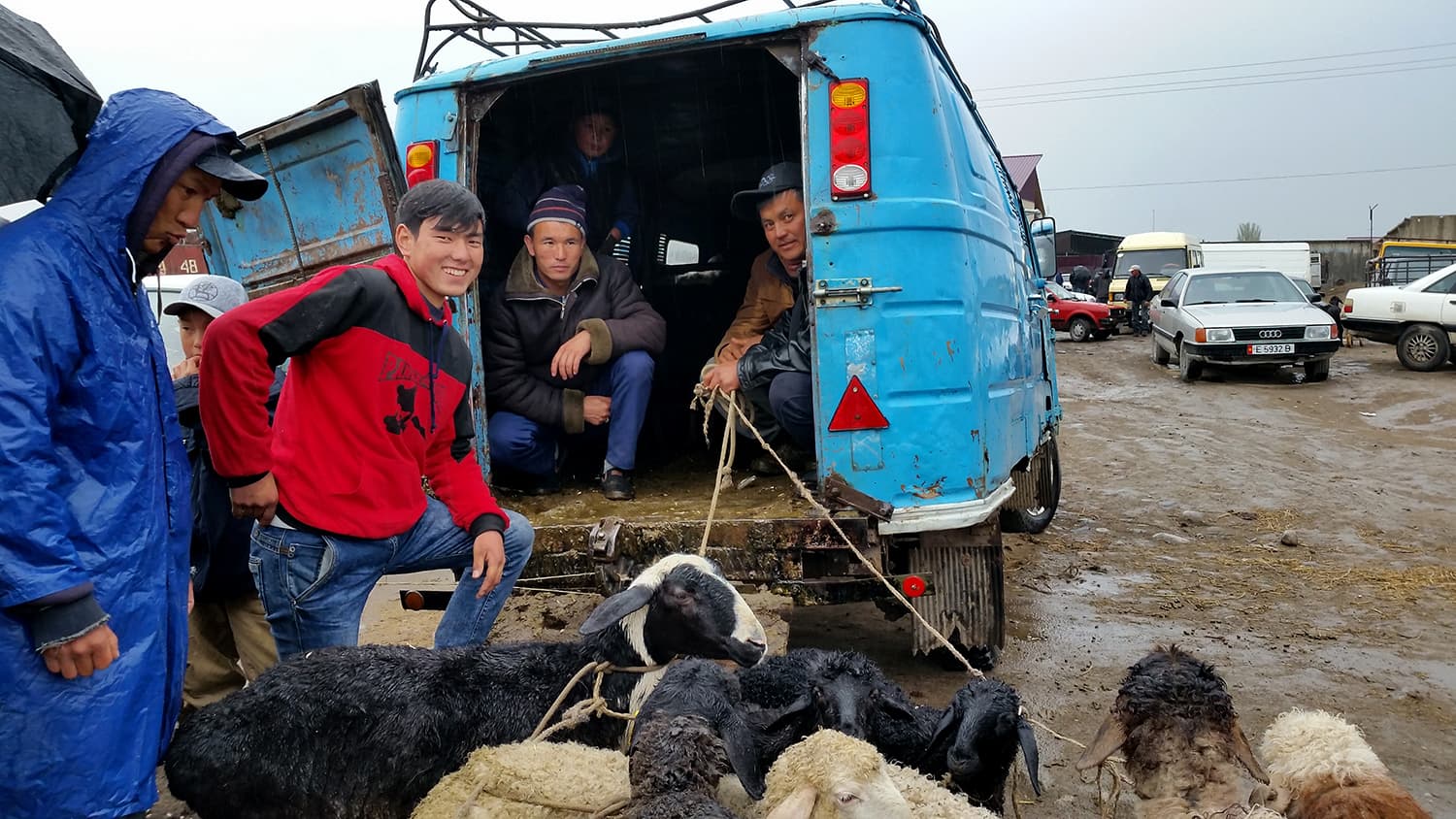 Selling with a smile at the weekly livestock market in Karakol, Kyrgyzstan.