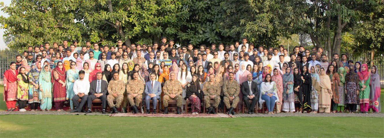 Chief of Army Staff Gen Qamar Javed Bajwa with officers and Baloch students. — ISPR