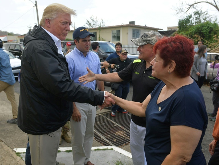 US President Donald Trump and First Lady Melania Trump met with residents affected by Hurricane Maria in Guaynabo, west of San Juan.—AFP US President Donald Trump and First Lady Melania Trump met with residents affected by Hurricane Maria in Guaynabo, west of San Juan.—AFP