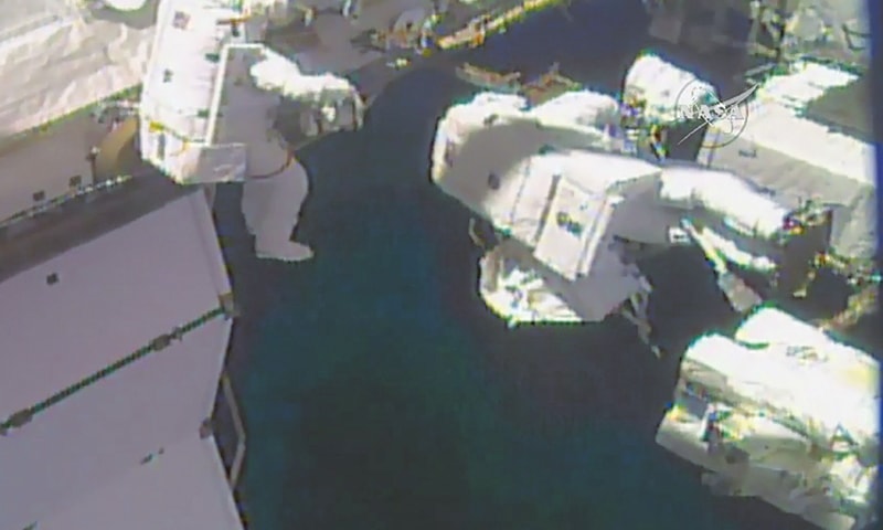 This Nasa TV video grab image obtained on Tuesday shows astronauts outside the International Space Station.&mdash;AFP
